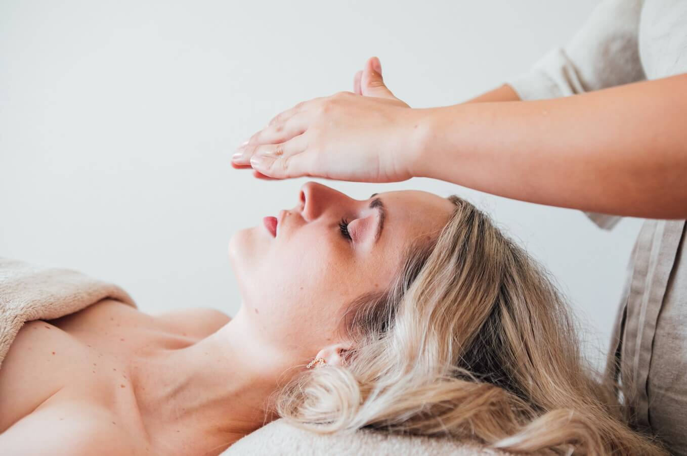 Woman Receiving A Buccal Facial Massage Treatment